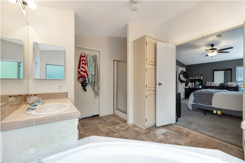 1051 Site, Unit 26 Brea, CA 92821 - Photo 32 of 46 a spacious bathroom with a sink double vanity and a mirror