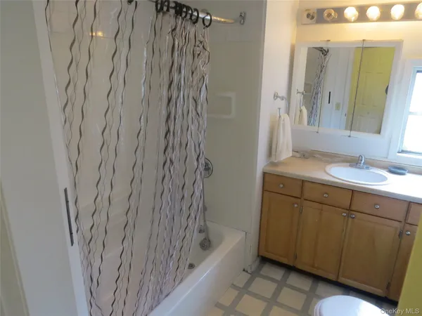 a bathroom with a bathtub and a sink
