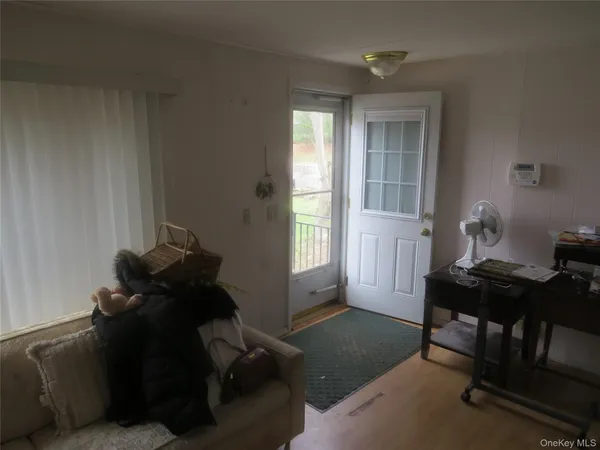 a living room with furniture and a window