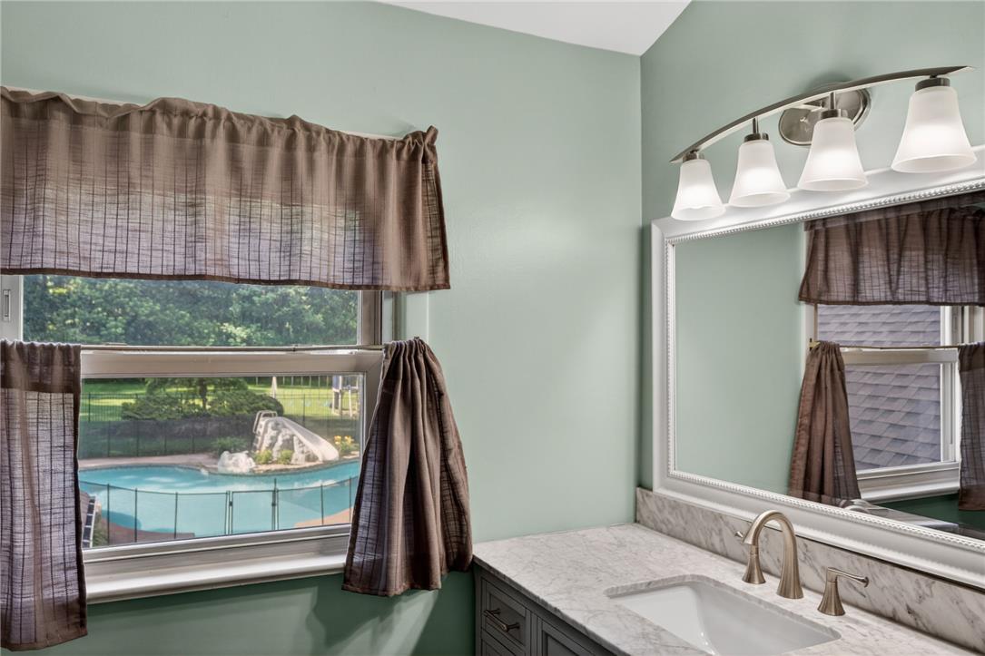1371 Stoke Park Road Bethlehem, PA 18017 - Photo 38 of 55 a bathroom with a sink and a mirror
