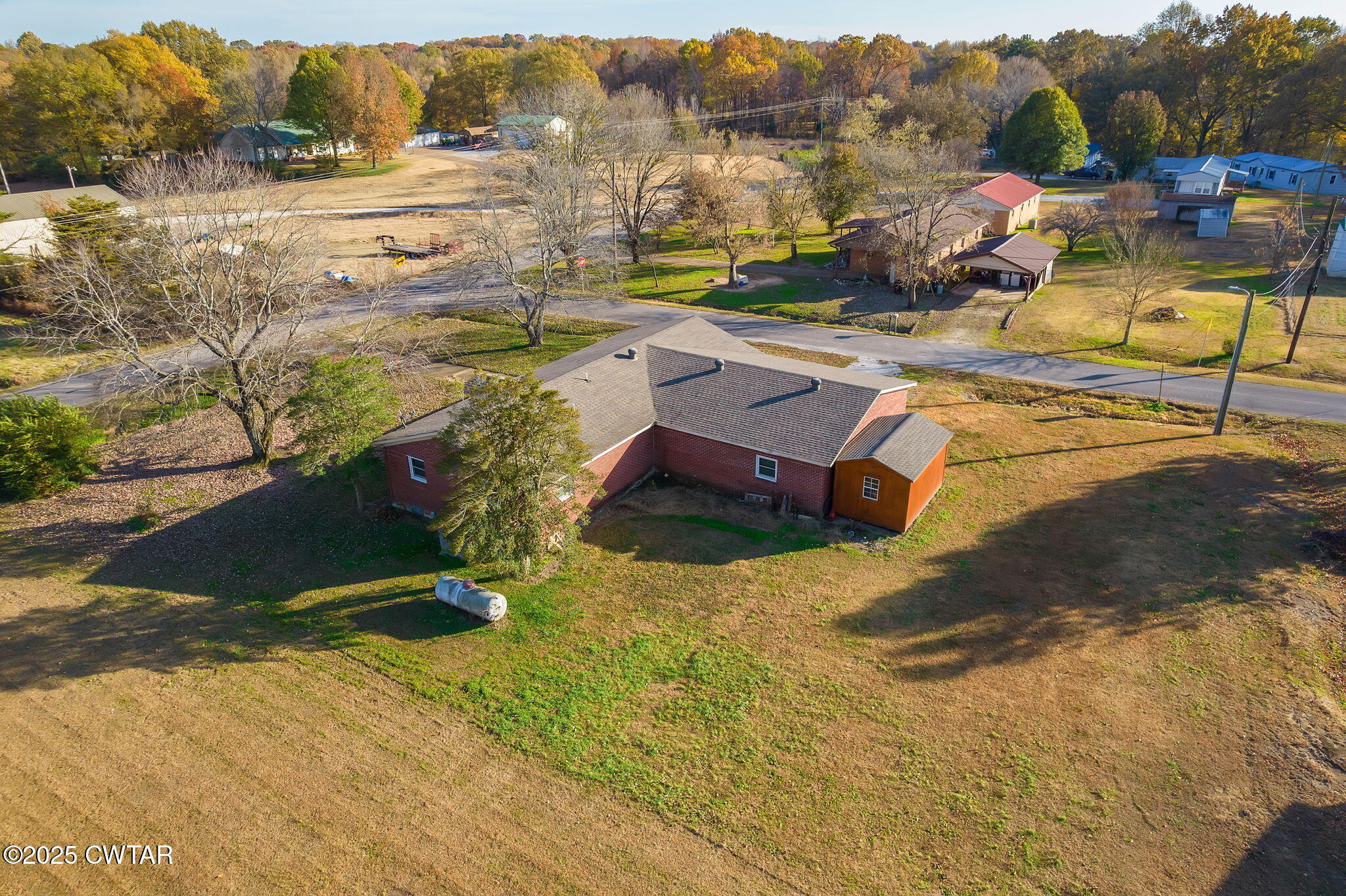 136 Mason Grove Road Humboldt, TN 38343 - Photo 11 of 36 a view of a swimming pool with a lawn chairs under an umbrella