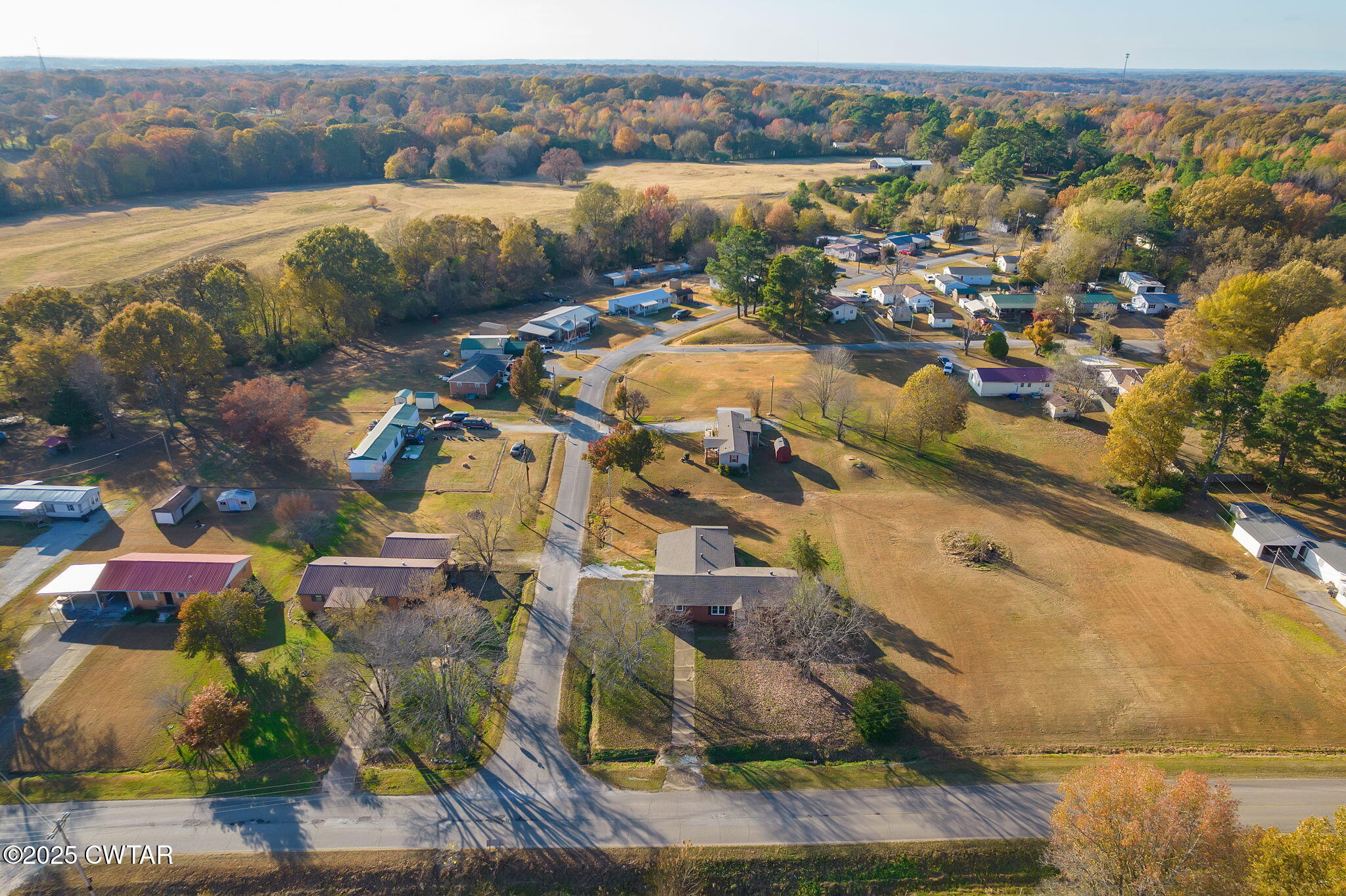 136 Mason Grove Road Humboldt, TN 38343 - Photo 14 of 36 an aerial view of residential houses with outdoor space