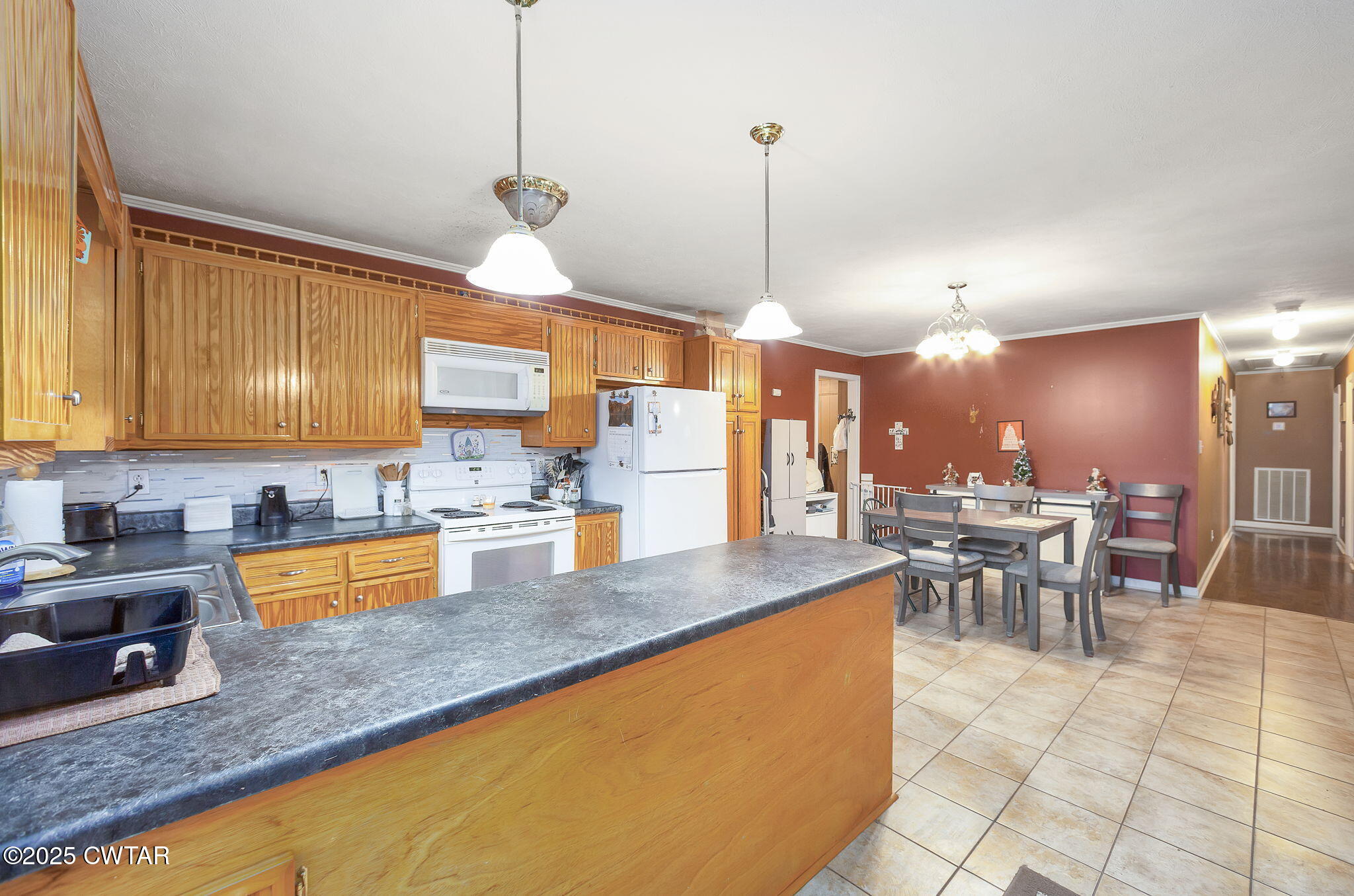 136 Mason Grove Road Humboldt, TN 38343 - Photo 20 of 36 a kitchen with stainless steel appliances granite countertop a sink a stove and a wooden cabinets