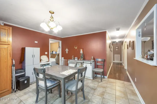 a living room with furniture a ceiling fan and a window