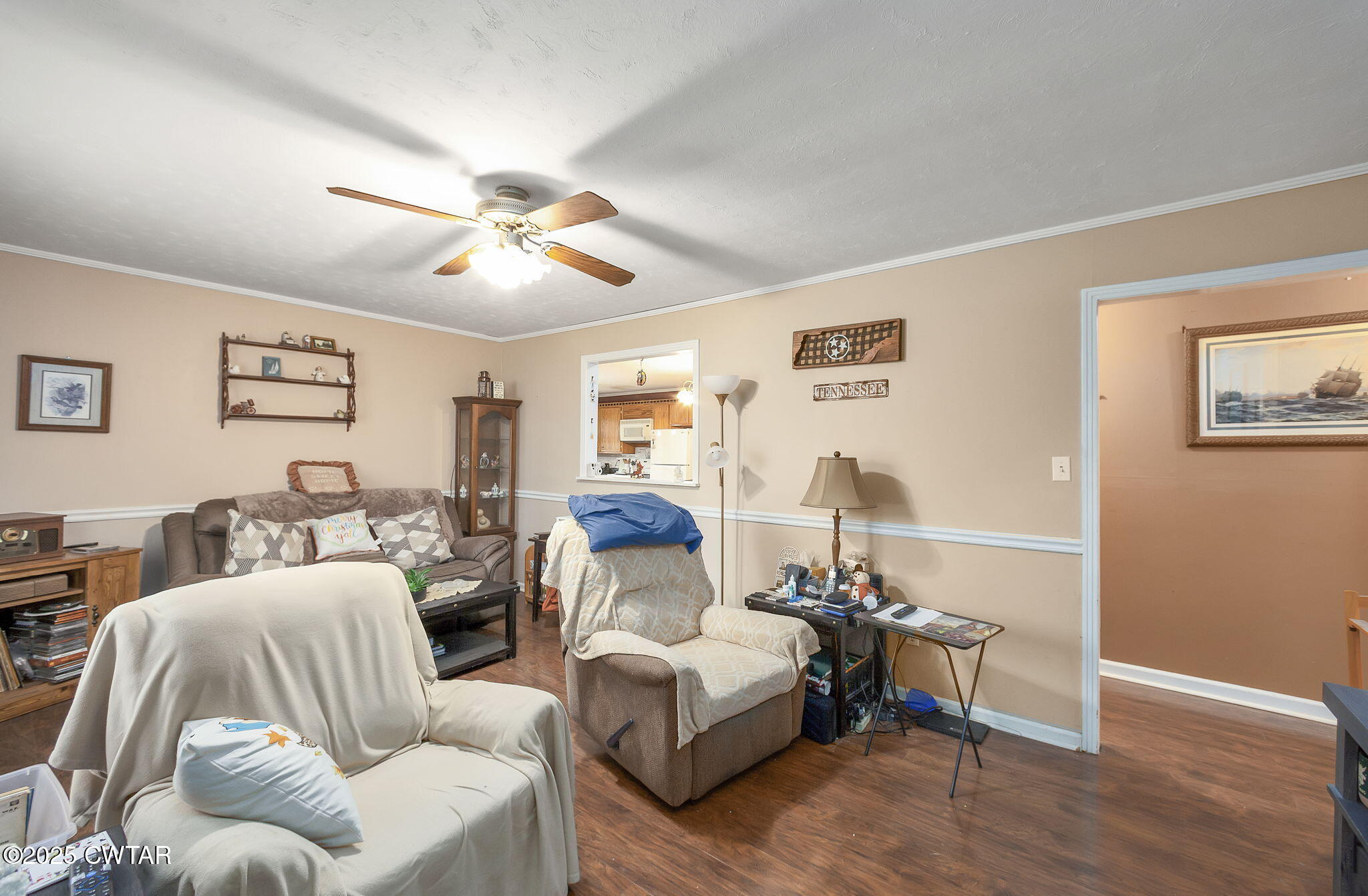 136 Mason Grove Road Humboldt, TN 38343 - Photo 24 of 36 a living room with furniture a ceiling fan and a window