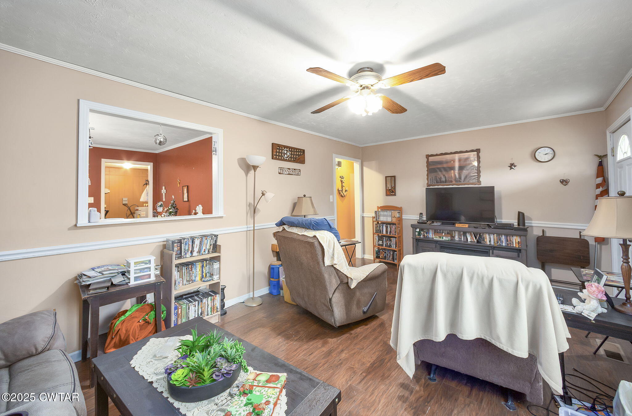136 Mason Grove Road Humboldt, TN 38343 - Photo 25 of 36 a living room with furniture and a flat screen tv
