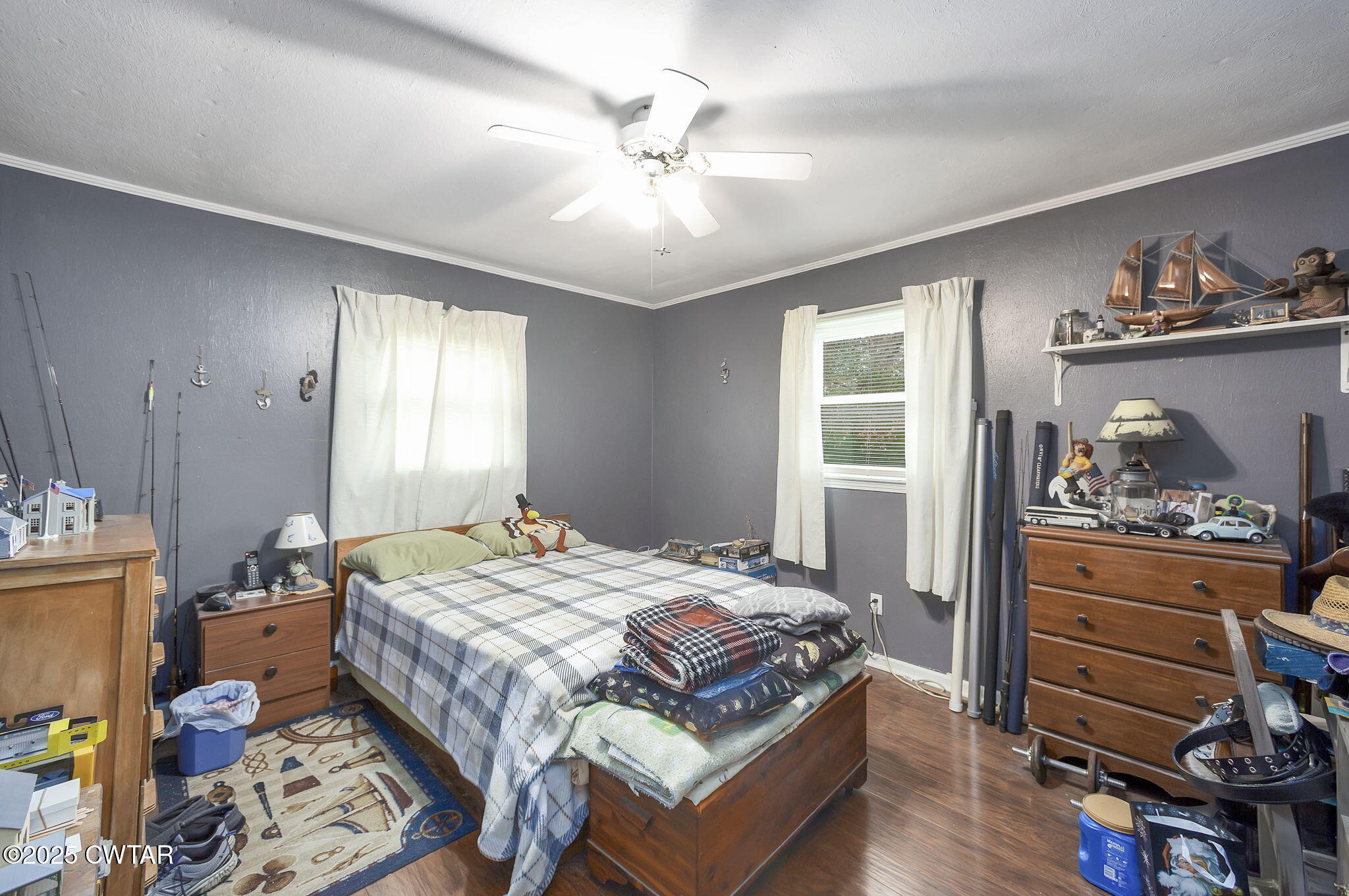 136 Mason Grove Road Humboldt, TN 38343 - Photo 28 of 36 a bedroom with a bed and wooden floor