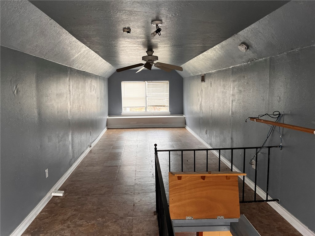 4101 College Main Street Bryan, TX 77801 - Photo 19 of 25 wooden floor in an empty room with a window