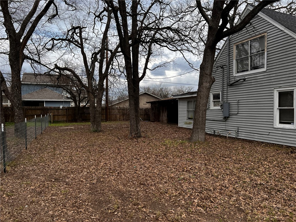 4101 College Main Street Bryan, TX 77801 - Photo 23 of 25 a view of a house with a backyard and tree