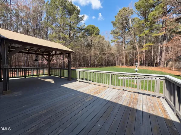 a view of a deck with a yard