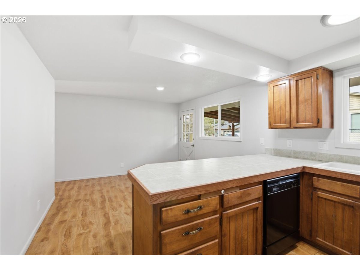 545 Baldwin Avenue Northeast Salem, OR 97301 - Photo 12 of 29 a kitchen with a sink and cabinets