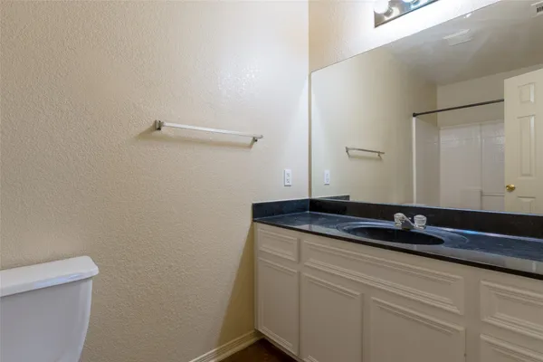 a white bath tub sitting next to a white toilet