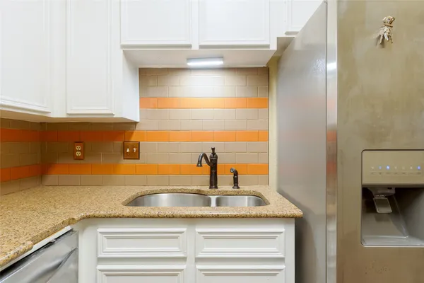 a kitchen with a sink and a window