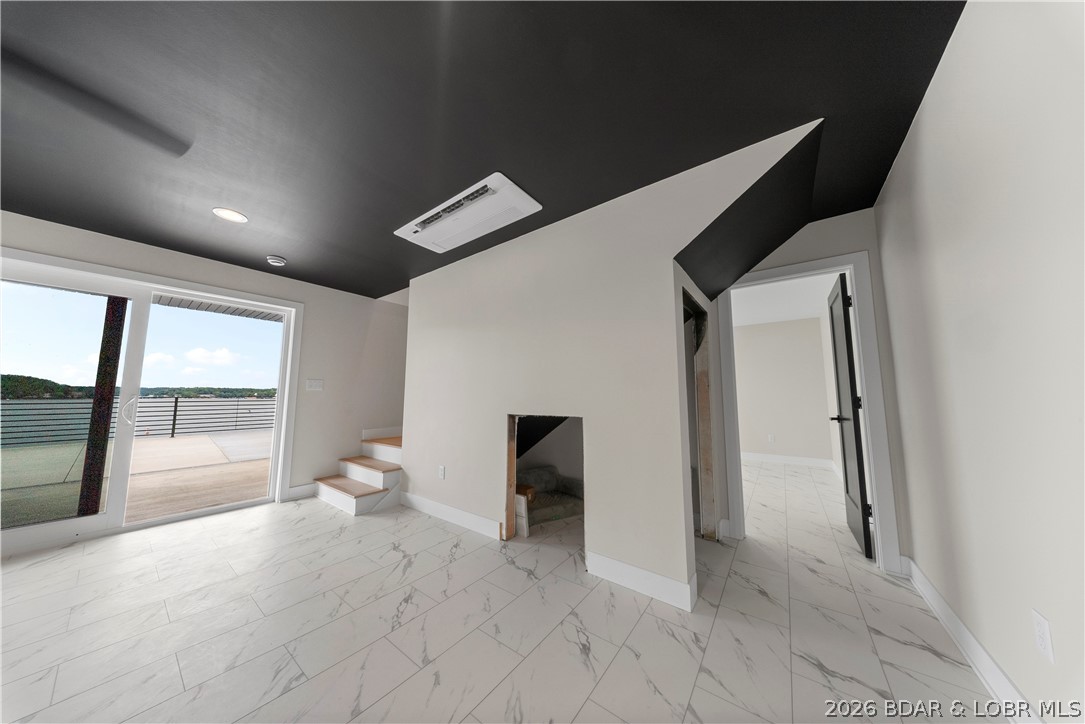 439 Red Bud Road Lake Ozark, MO 65049 - Photo 73 of 98 Spacious lower-level recreation room featuring soa