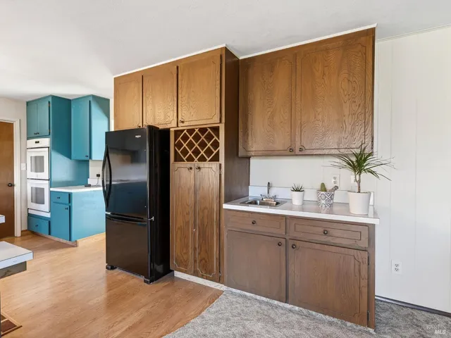 a bathroom with a sink and mirror with toilet
