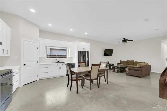 a view of a dining room with furniture and window