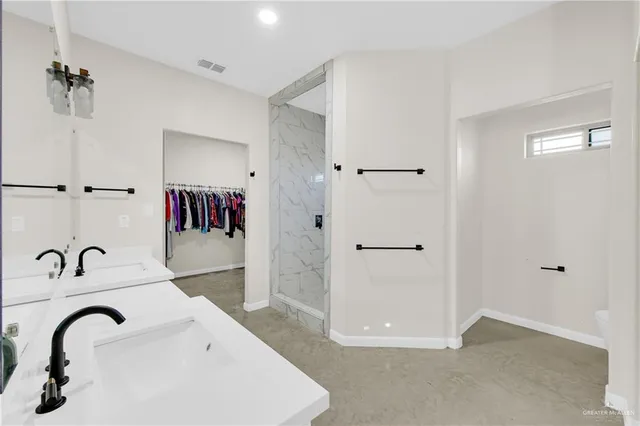 a bathroom with a sink and a shower