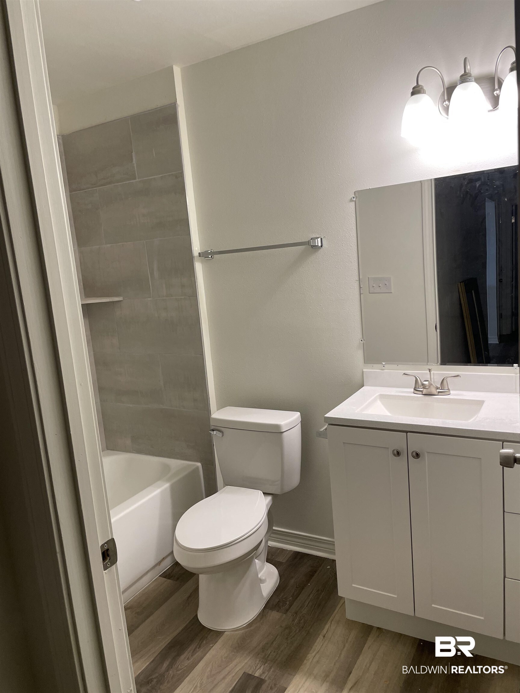 2 Canterberry Circle Foley, AL 36535 - Photo 3 of 24 Full bath featuring toilet, washtub / shower combination, vanity, wood finished floors, and baseboards