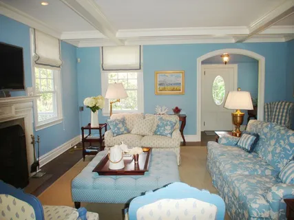 a living room with furniture fireplace and a flat screen tv