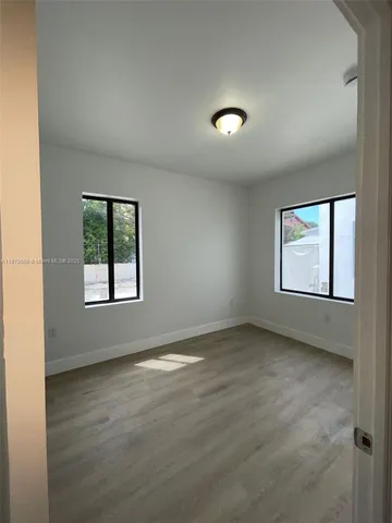 an empty room with windows