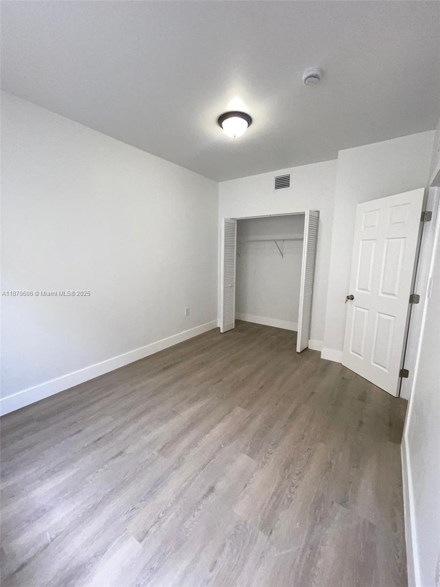858 Northwest 3rd Street, Unit 112 Miami, FL 33128 - Photo 10 of 15 a view of empty room
