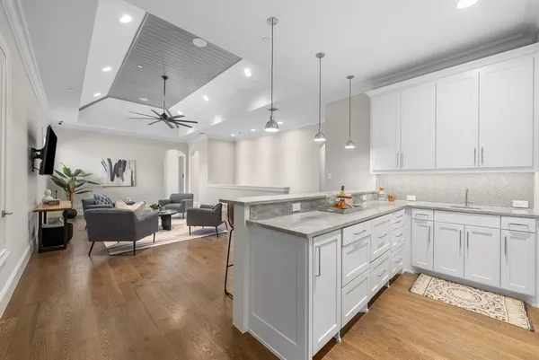a kitchen with stainless steel appliances granite countertop a lot of counter space and a sink