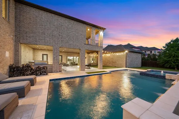 a view of a house with pool table and chairs