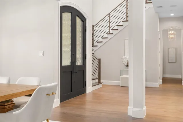 a view of entryway with wooden floor and stairs