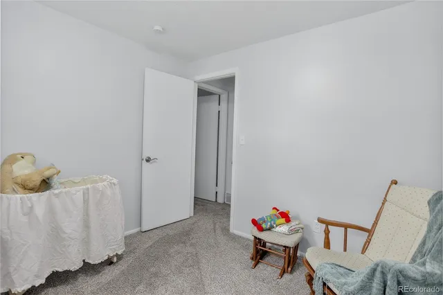 a open dining room with kitchen island furniture a large window and a sink