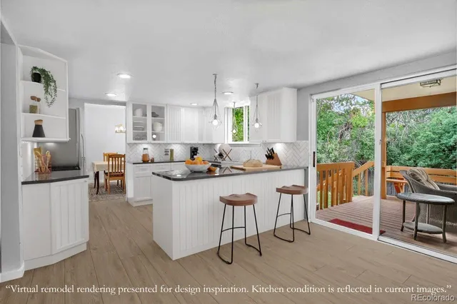 a view of a dining room with furniture and a chandelier