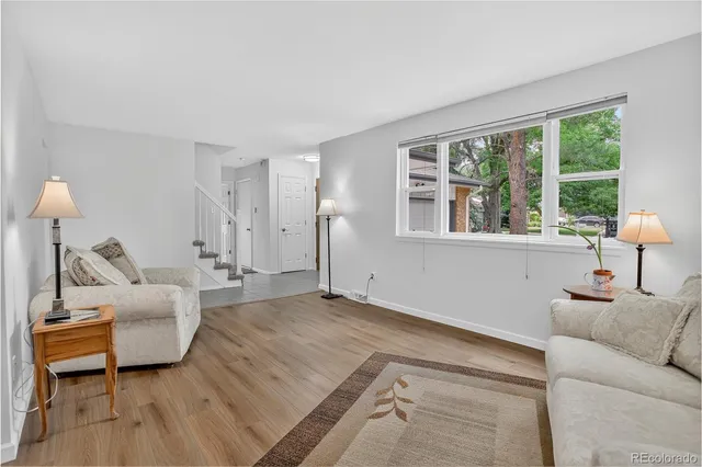 a kitchen with stainless steel appliances granite countertop a sink refrigerator and cabinets