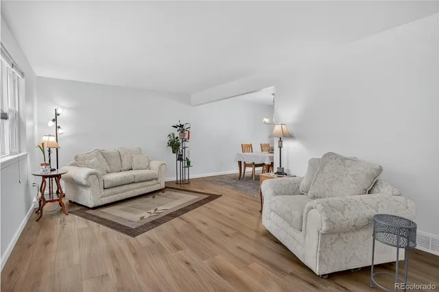 a kitchen with a refrigerator and a sink