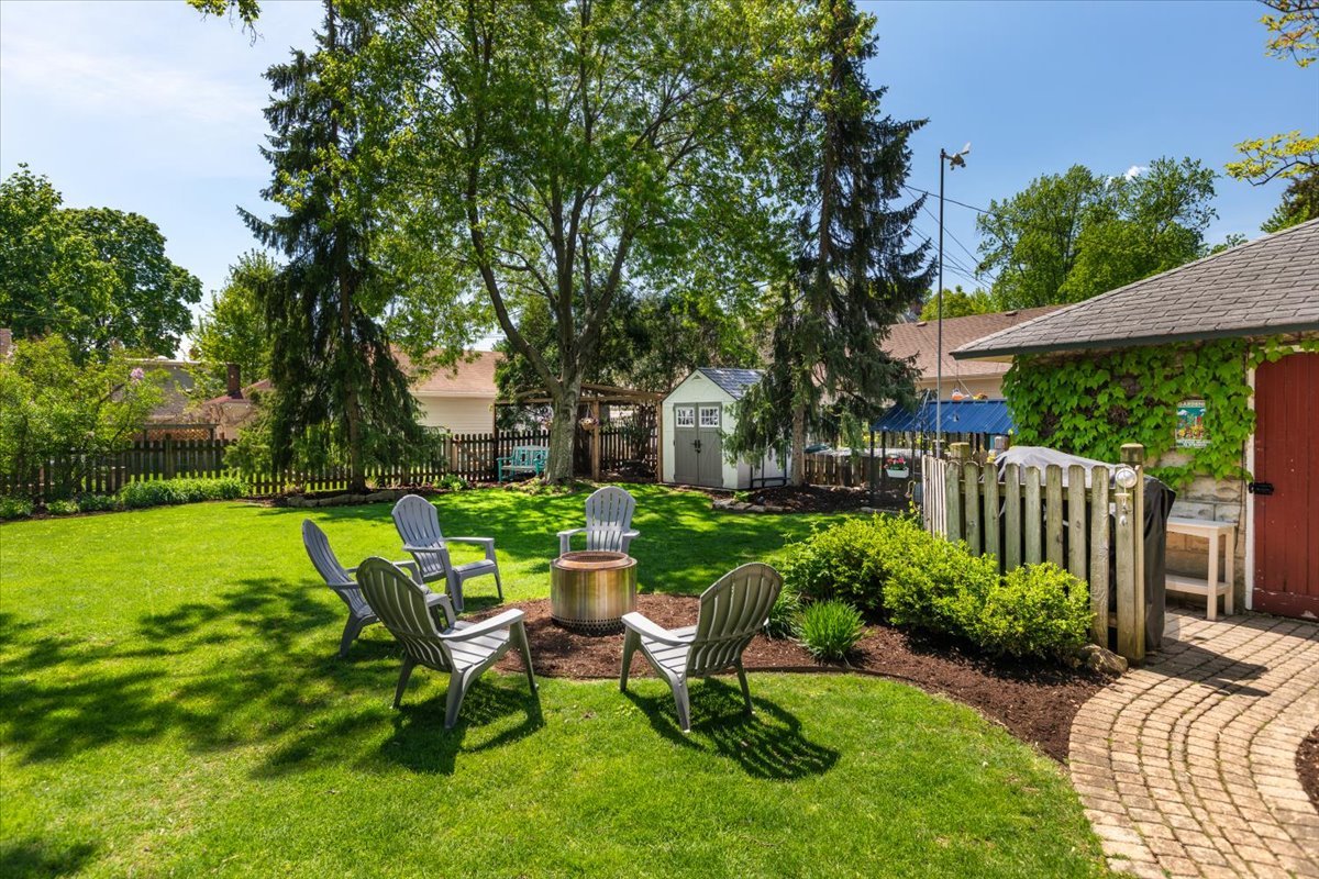 23 Columbia Street Naperville, IL 60540 - Photo 85 of 94 a view of a chair and table in backyard of the house