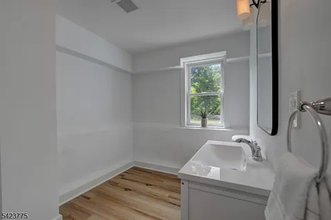 a bathroom with a sink and window