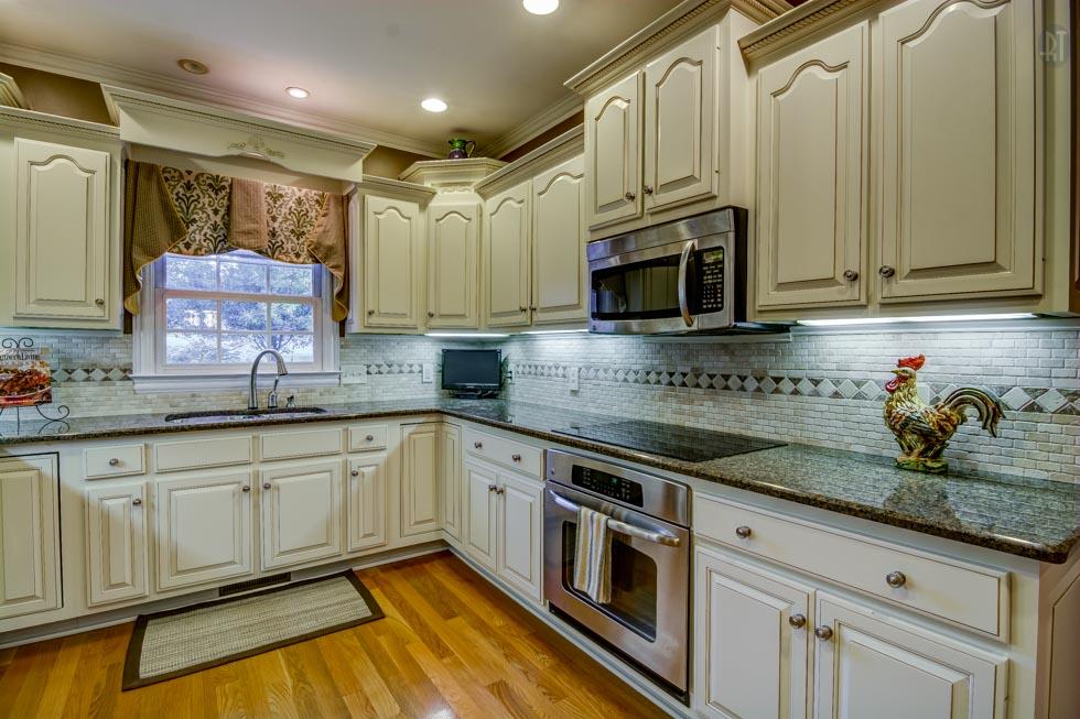 2352 Baker Road Goodlettsville, TN 37072 - Photo 3 of 29 Recently updated kitchen featuring stainless steel appliances, granite counters, tiled back splash, 20 bottle wine fridge, & a spacious pantry