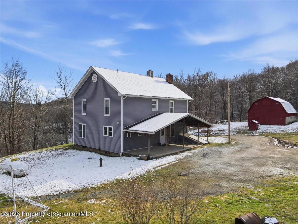 795 Wescott Road New Milford, PA 18834 - Photo 6 of 81 a front view of a house with a yard