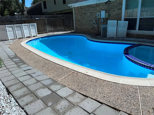 a view of outdoor space and swimming pool