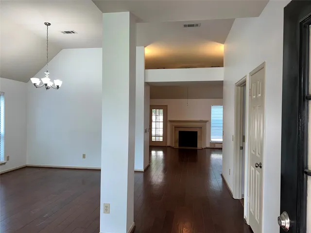 wooden floor in a hall with a mirror