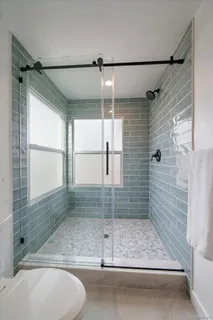 a bathroom with a bathtub and shower