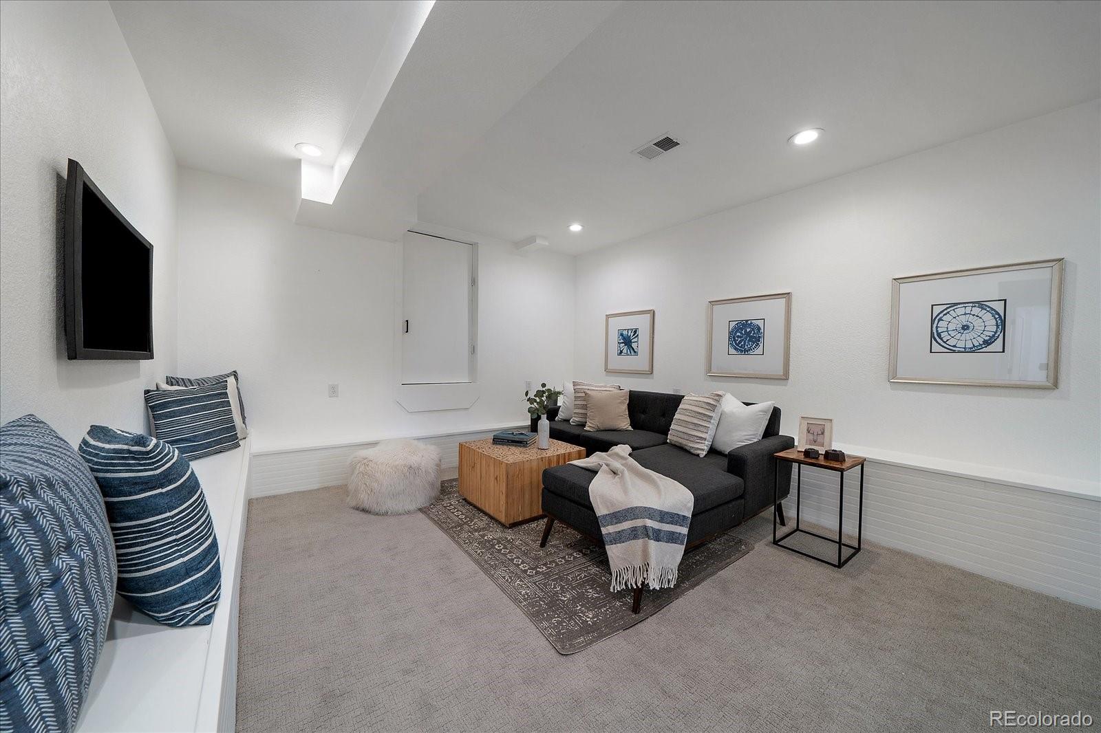 9200 Grandview Avenue Arvada, CO 80002 - Photo 23 of 45 a living room with furniture and a flat screen tv