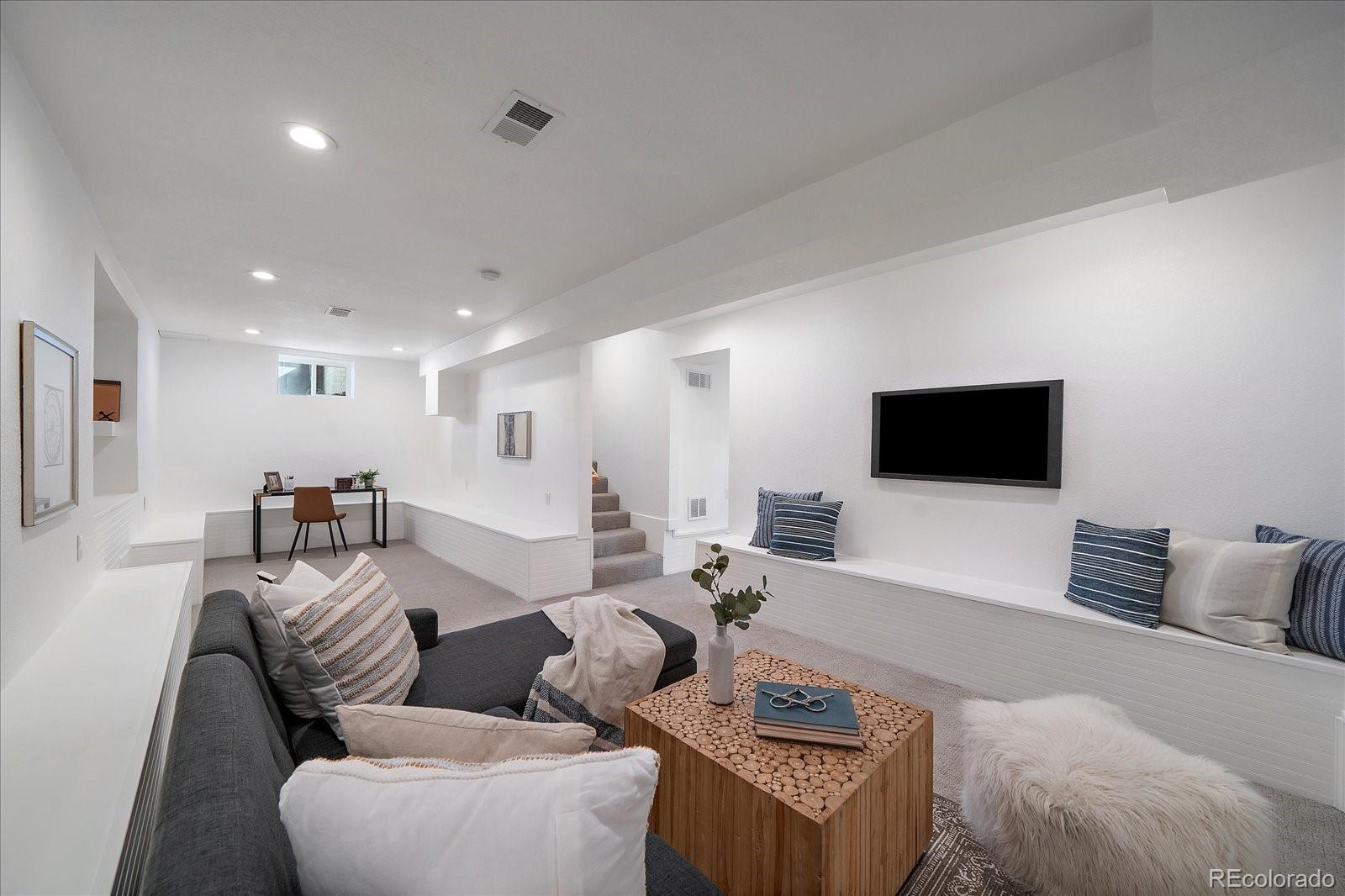 9200 Grandview Avenue Arvada, CO 80002 - Photo 25 of 45 a living room with furniture and a flat screen tv