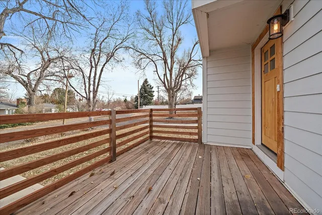 a view of backyard with deck and wooden floor