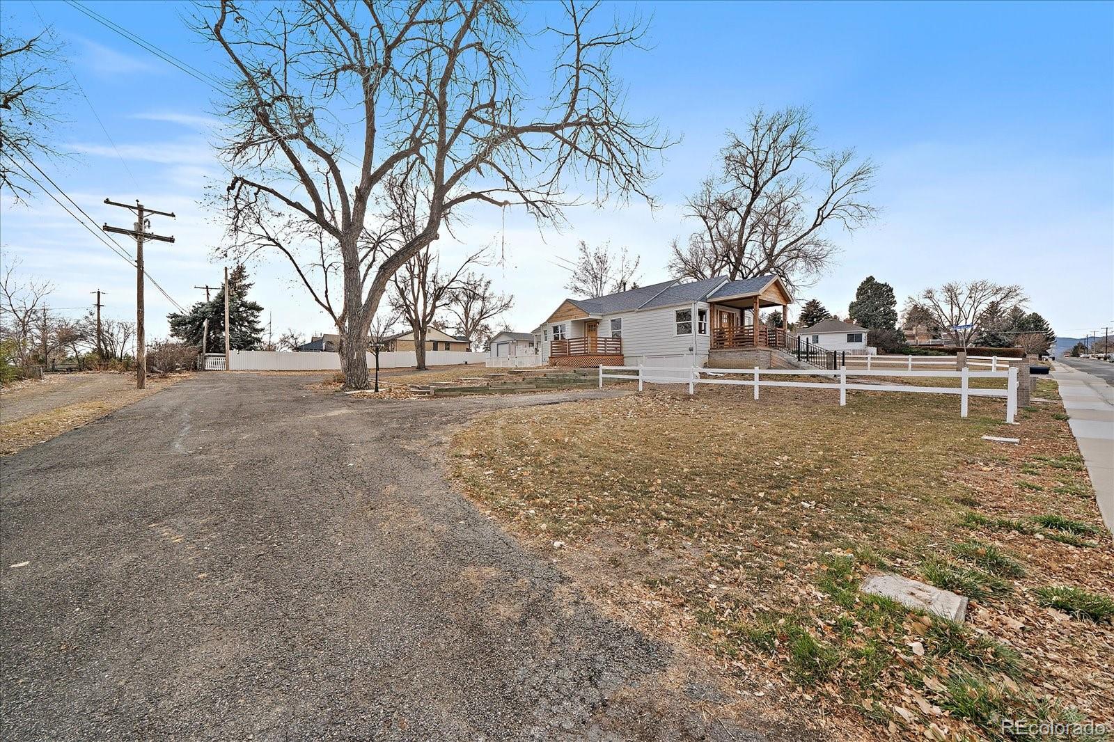 9200 Grandview Avenue Arvada, CO 80002 - Photo 37 of 45 a front view of a house with a yard
