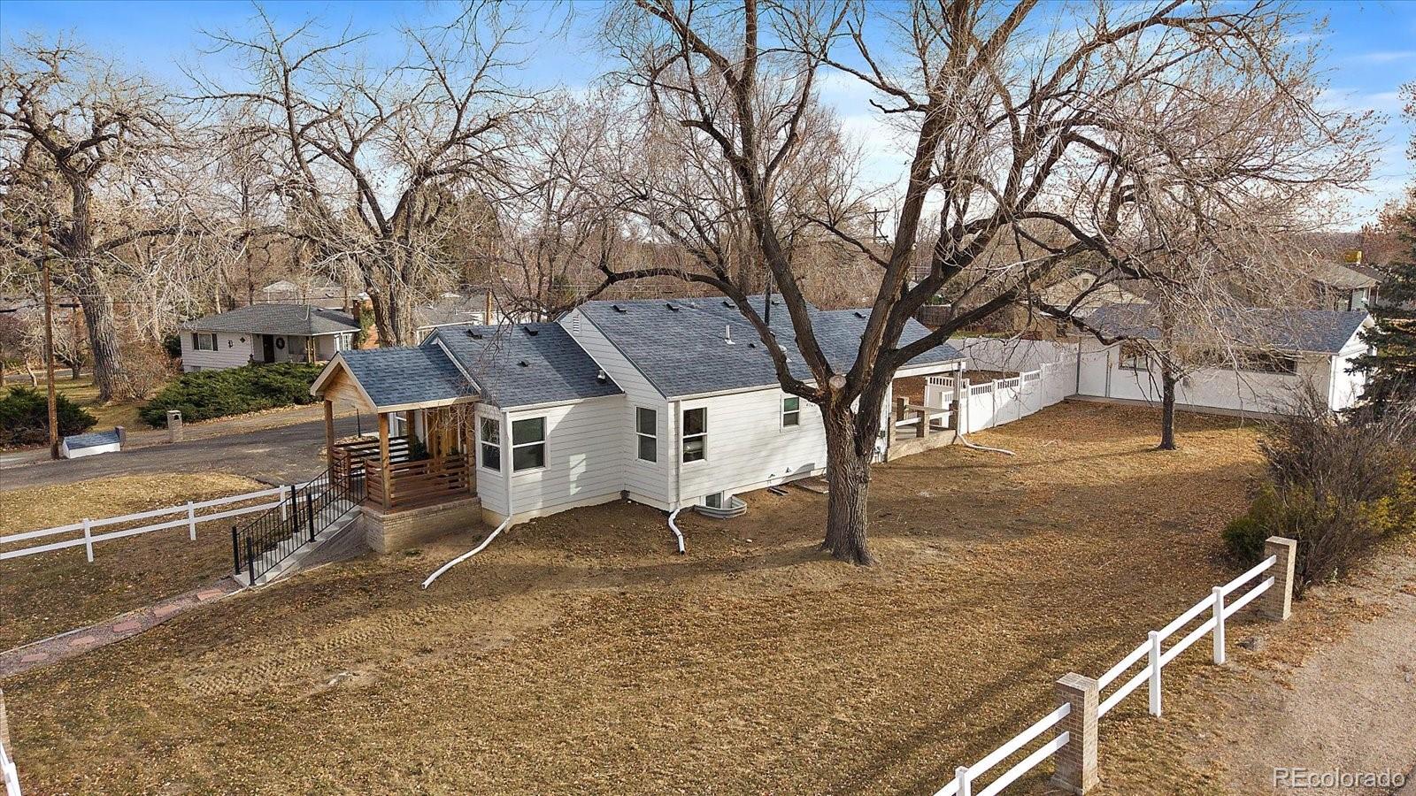 9200 Grandview Avenue Arvada, CO 80002 - Photo 42 of 45 a view of a house with a yard