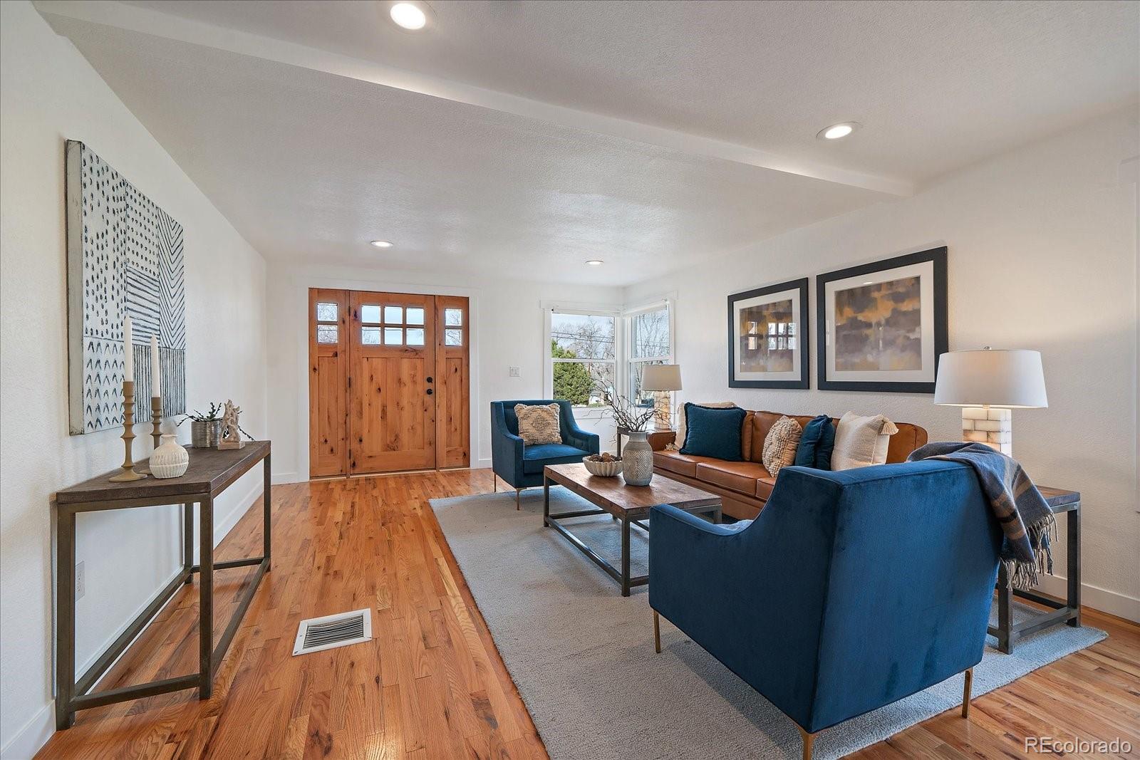 9200 Grandview Avenue Arvada, CO 80002 - Photo 5 of 45 a living room with furniture and wooden floor