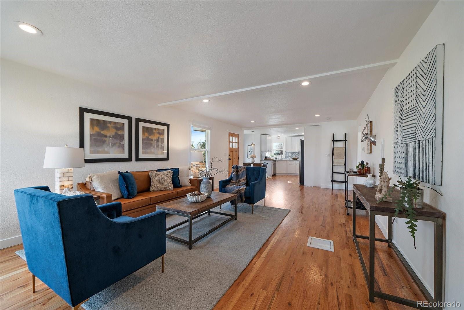 9200 Grandview Avenue Arvada, CO 80002 - Photo 8 of 45 a living room with furniture wooden floor and a lamp
