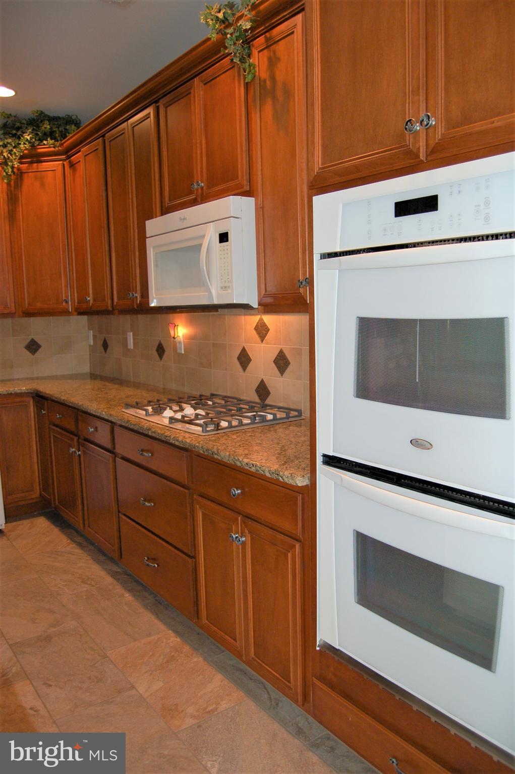 241 Stoyer Road Coatesville, PA 19320 - Photo 12 of 57 Abundant granite countertops & tile backsplash