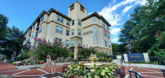 a view of living room with granite countertop furniture and fireplace