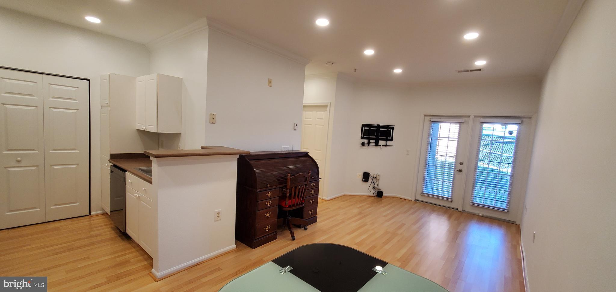 11800 Old Georgetown Road, Unit 1103 Rockville, MD 20852 - Photo 14 of 29 a view of kitchen with wooden floor and electronic appliances