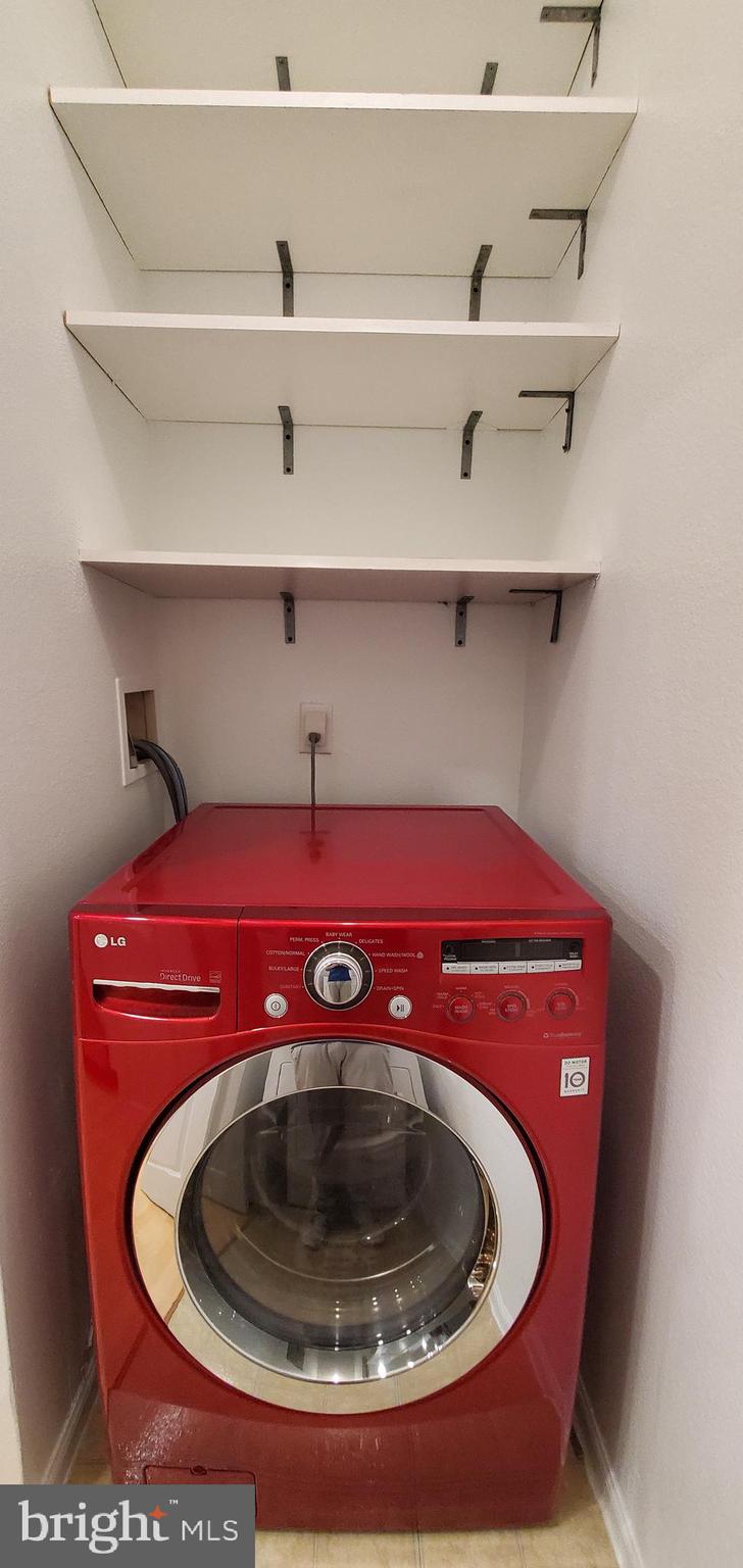 11800 Old Georgetown Road, Unit 1103 Rockville, MD 20852 - Photo 19 of 29 a utility room with a stove and cabinets